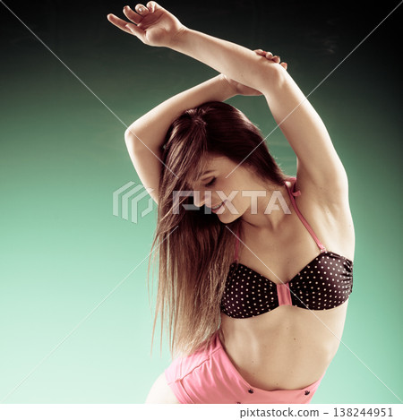 woman in swimsuit dancing pose woman in swimsuit dancing pose 138244951