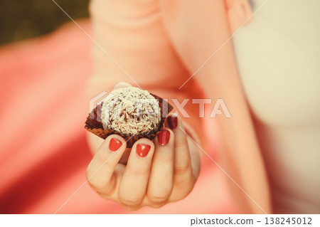 Woman with liitle cookie cupcake. Woman with liitle cookie cupcake. 138245012