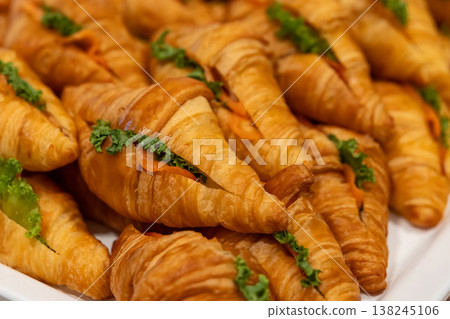 Fresh Baked Croissants . A pile of tasty crispy croissant on restaurant buffet Fresh Baked Croissants . A pile of tasty crispy croissant on restaurant buffet 138245106