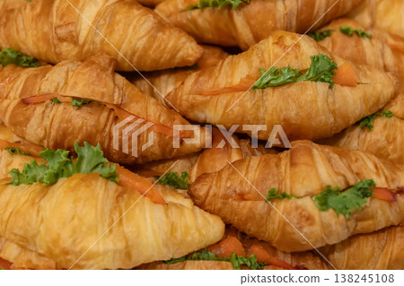 Fresh Baked Croissants . A pile of tasty crispy croissant on restaurant buffet Fresh Baked Croissants . A pile of tasty crispy croissant on restaurant buffet 138245108