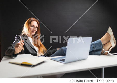 Casual businesswoman working enjoying comfort and flexibility Casual businesswoman working enjoying comfort and flexibility 138245275