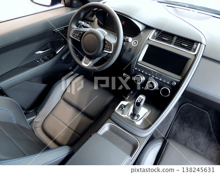 Black leather trimmed front seats with blue thread stitch in car interior Black leather trimmed front seats with blue thread stitch in car interior 138245631
