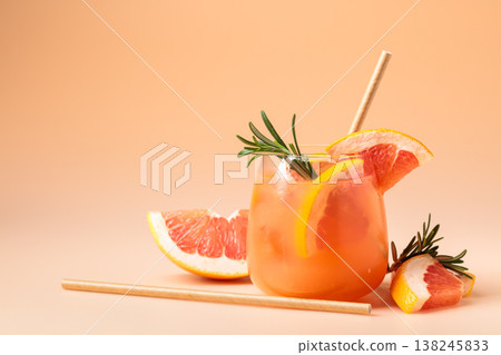 Summer cocktail with grapefruit, rosemary, and ice. Summer cocktail with grapefruit, rosemary, and ice. 138245833