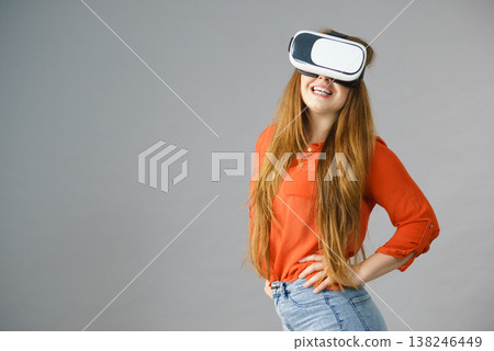 Girl wearing virtual reality goggles. Girl wearing virtual reality goggles. 138246449