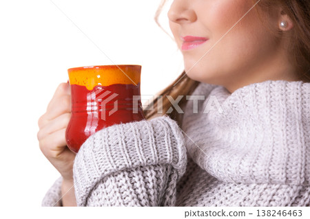 Woman holding red tea coffee mug Woman holding red tea coffee mug 138246463