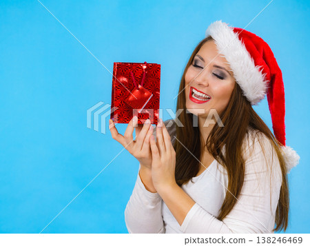 Happy Christmas woman holds gift bag Happy Christmas woman holds gift bag 138246469