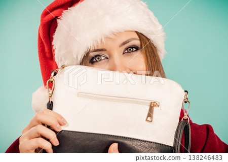 Christmas girl holding handbag present Christmas girl holding handbag present 138246483