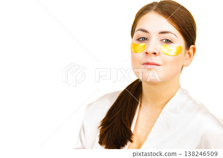 Woman with gold patches under eyes Woman with gold patches under eyes 138246509