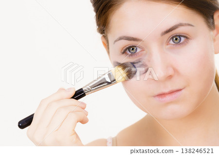 Woman being apply black carbo mask to face Woman being apply black carbo mask to face 138246521