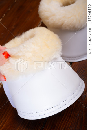 white hoof protectors with natural fur for sportive horses. horse stuff and care white hoof protectors with natural fur for sportive horses. horse stuff and care 138246530