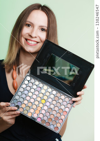 Woman holds makeup professional colorful palette Woman holds makeup professional colorful palette 138246547