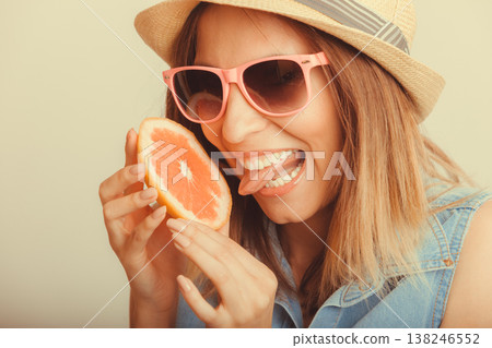 Happy woman in hat drinking grapefruit juice. Diet Happy woman in hat drinking grapefruit juice. Diet 138246552
