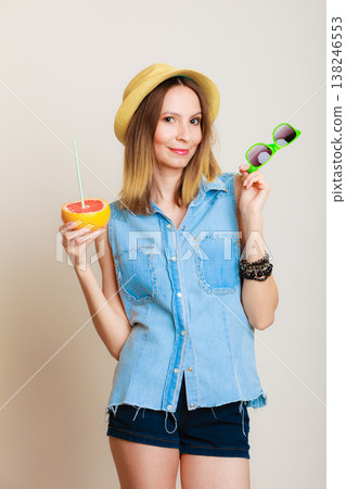 Summer girl tourist holding grapefruit citrus fruit Summer girl tourist holding grapefruit citrus fruit 138246553