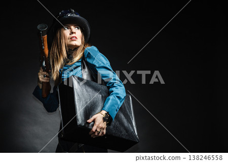 beautiful steampunk woman with bag and gun on black. 138246558
