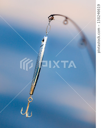 saltwater fishing - rod with wobbler and blue sea water saltwater fishing - rod with wobbler and blue sea water 138246619