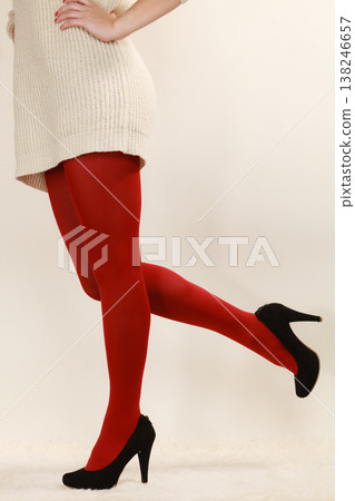 woman legs in red vivid color pantyhose black high heels shoes 138246657
