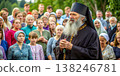 Elderly Russian Orthodox Priest Addresses Congregation Outdoors. Generative AI 138246781