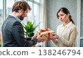 Man Presenting Gift to Woman With Unsure Expression in Modern Office Setting. Generative AI 138246794