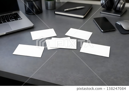 Workspace with blank business cards on desk. Corporate branding mockup with laptop. Clean template for identity, marketing and print design. AI generated image. Workspace with blank business cards on desk. Corporate branding mockup with laptop. Clean template for identity, marketing and print design. AI generated image. 138247084