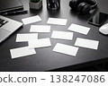 Workspace with blank business cards on desk. Corporate branding mockup with laptop. Clean template for identity, marketing and print design. AI generated image. 138247086