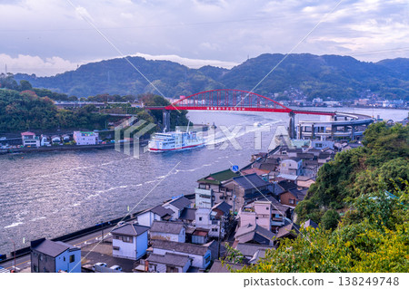 Morning view of the Ondo Bridge from the Kurahashi Island side, with the ferry boat Asahiyo Maru 4 passing through the Ondo Strait. Kure City, Hiroshima Prefecture. Morning view of the Ondo Bridge from the Kurahashi Island side, with the ferry boat Asahiyo Maru 4 passing through the Ondo Strait. Kure City, Hiroshima Prefecture. 138249748
