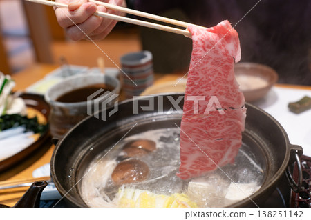 The moment you dip the finest marbled Wagyu beef into the shabu-shabu pot. The moment you dip the finest marbled Wagyu beef into the shabu-shabu pot. 138251142