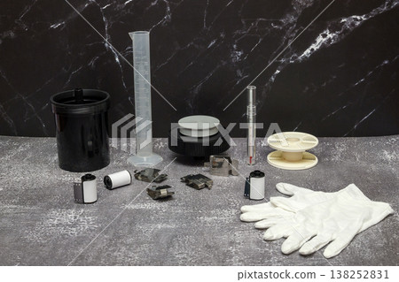 still life photography of accessories for a home photo laboratory on a dark background in interior still life photography of accessories for a home photo laboratory on a dark background in interior 138252831
