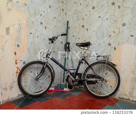 folding bicycle and cleaning equipment near a wall folding bicycle and cleaning equipment near a wall 138253276