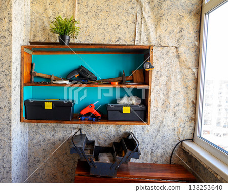 shelf with tools on the balcony 138253640