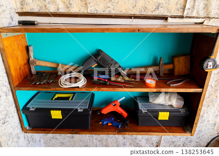 home workshop with tools on a shelf 138253645