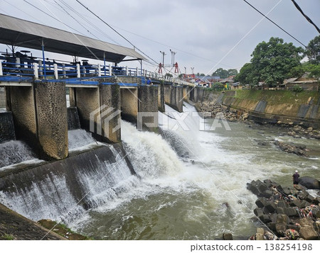 An aerial drone perspective reveals the historic Katulampa Dam spanning the Ciliwung River in Bogor An aerial drone perspective reveals the historic Katulampa Dam spanning the Ciliwung River in Bogor 138254198