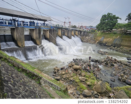 An aerial drone perspective reveals the historic Katulampa Dam spanning the Ciliwung River in Bogor An aerial drone perspective reveals the historic Katulampa Dam spanning the Ciliwung River in Bogor 138254202