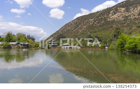 Amazing view of the Black Dragon Pool in the Jade Spring Park, Lijiang, Yunnan province China. Amazing view of the Black Dragon Pool in the Jade Spring Park, Lijiang, Yunnan province China. 138254373