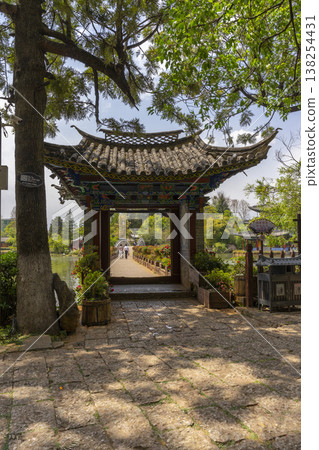 Lijiang, China - April 12, 2024 : : People enjoy weather at Black Dragon Pool Park in Dayan old town in Lijiang Old Town, China on April 12, 2024. Lijiang, China - April 12, 2024 : : People enjoy weather at Black Dragon Pool Park in Dayan old town in Lijiang Old Town, China on April 12, 2024. 138254431