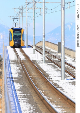 A train running through the snow: Utsunomiya Light Rail, Tobiyama Castle Ruins Station 138255297