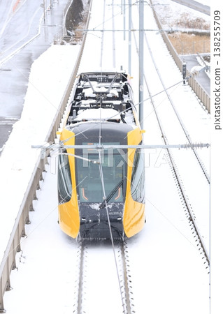 A streetcar running through the snow: Utsunomiya Light Rail 138255709
