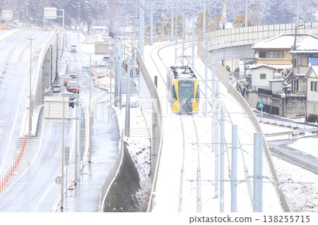 A streetcar running through the snow: Utsunomiya Light Rail 138255715