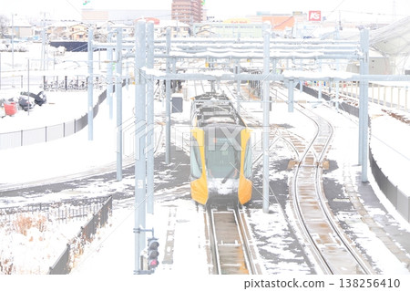 Utsunomiya Hiraishi Station "Light Rail and Snow Scenery" 138256410