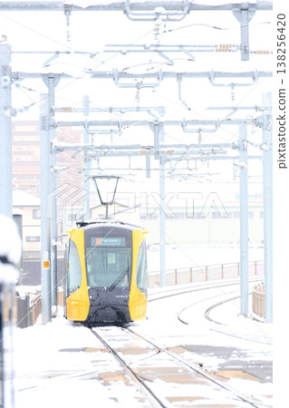 Utsunomiya Hiraishi Station "Light Rail and Snow Scenery" 138256420