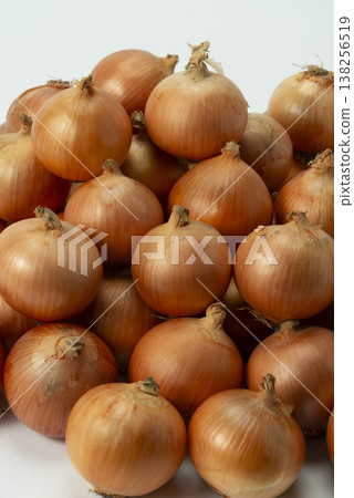 A pile of onions against a white background A pile of onions against a white background 138256519
