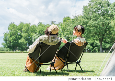 Parents and children/families chairing in parks and campsites Parents and children/families chairing in parks and campsites 138256561