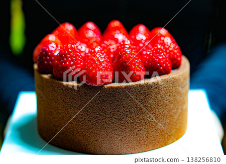 Chocolate and strawberry cake on a dark background. Bakery products 138256810