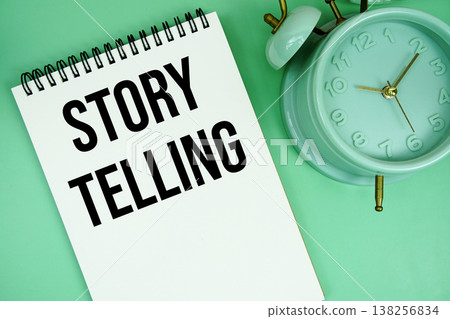 Storytelling text with alarm clock flat lay on green background 138256834