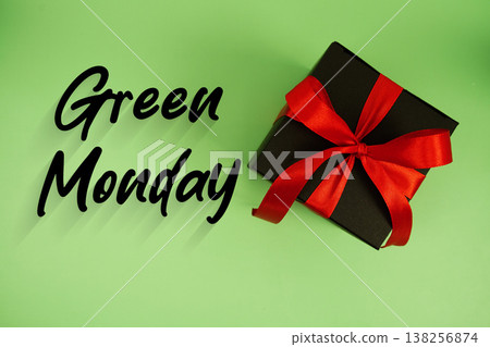 Green Monday text with gift box present on green background 138256874