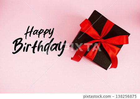 Happy Birthday text with gift box present on pink background 138256875