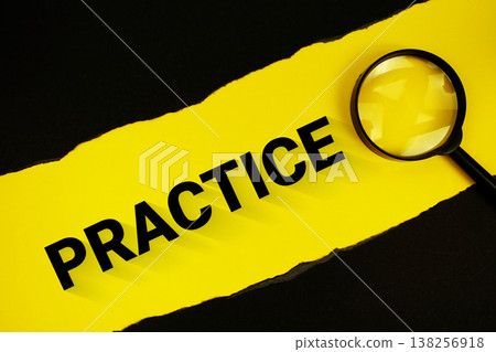 Practice text on yellow with black paper torn ripped and magnifying glass Practice text on yellow with black paper torn ripped and magnifying glass 138256918