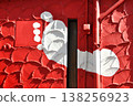 Footprints painted white on a red wall 138256923