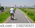 Senior man walking along the Yodo River 138256925