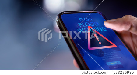 Smartphone shows flash flood alert, Climate change, Technology for safety 138256989