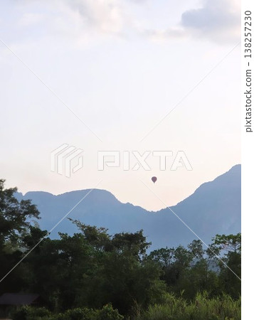 a rising hot air balloon  138257230